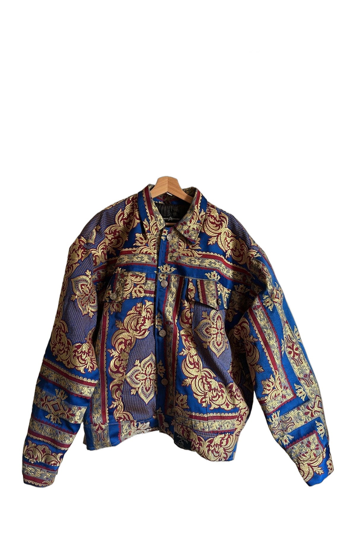 Anouri Blue Jacket with Red & Yellow Details – Vorderansicht am Bügel